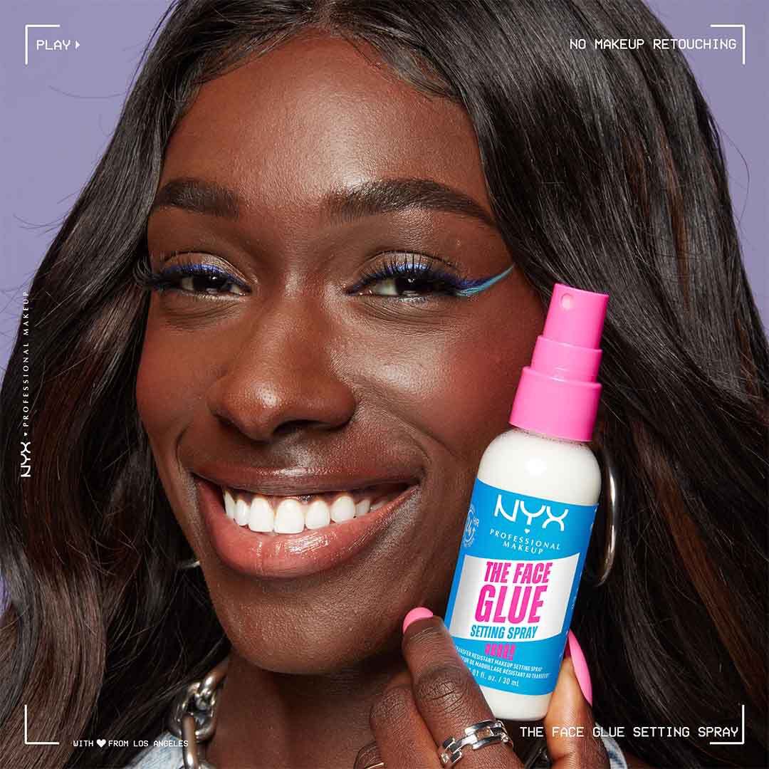 NYX Face Glue Setting Spray applied on dark skinned model